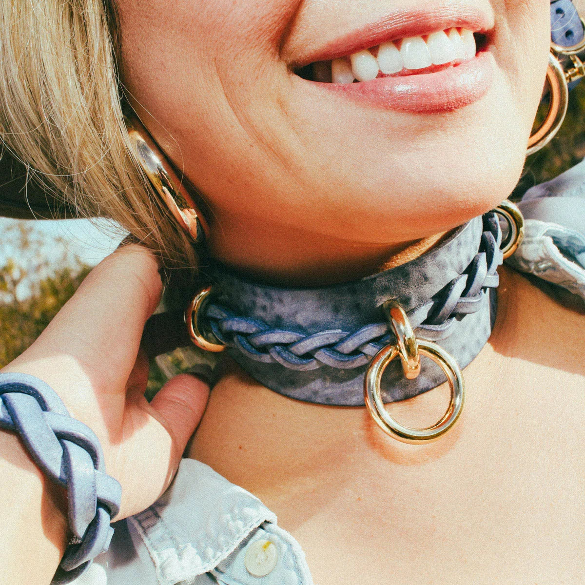 woman smiling wearing blue leather cowboy core festival fashion