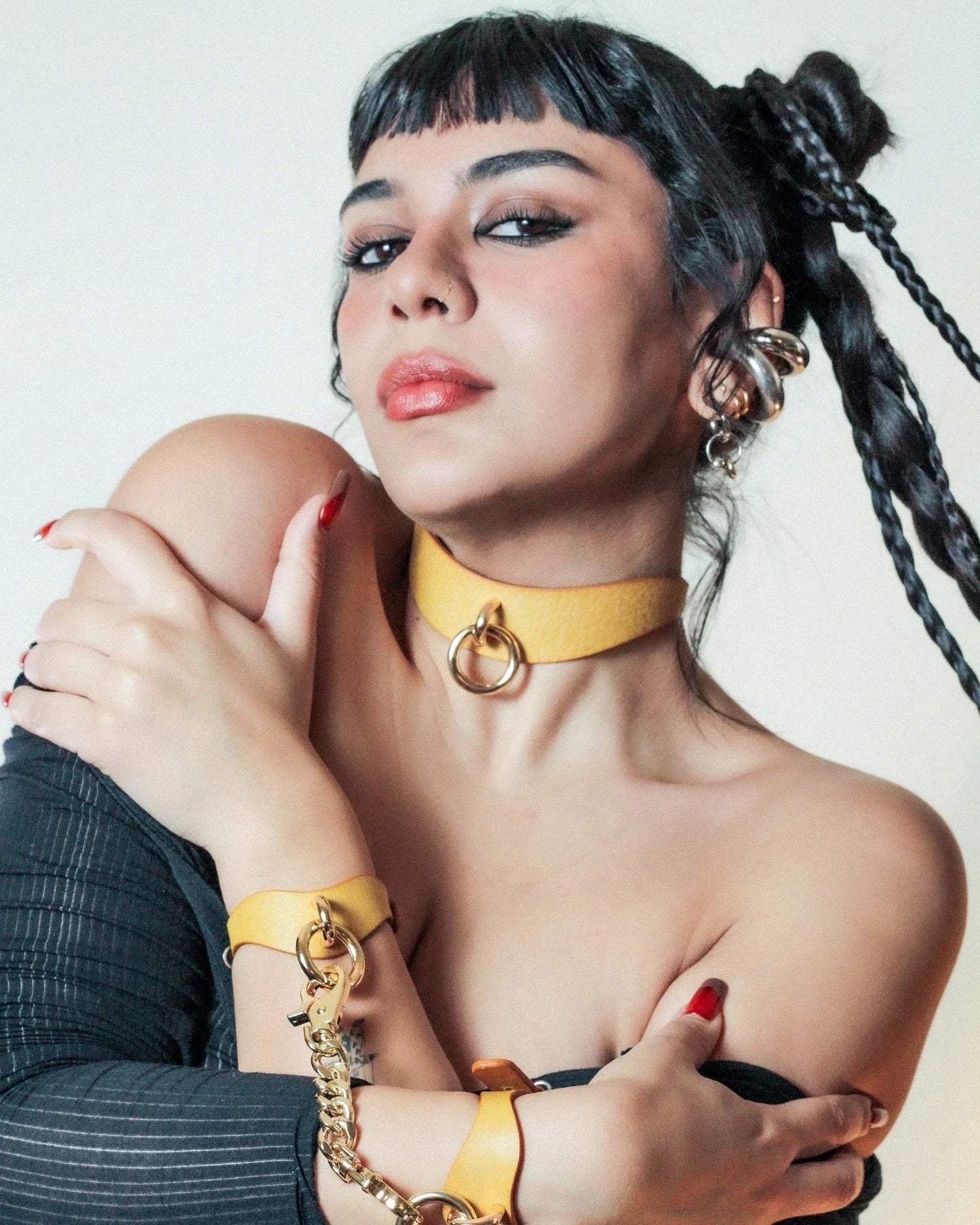 woman wearing yellow day collar and yello w bdsm cuffs