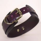 Side view of the 'Milky Way' burgundy BDSM collar, detailing the elegant gold-tone buckle and the multiple size adjustment holes.