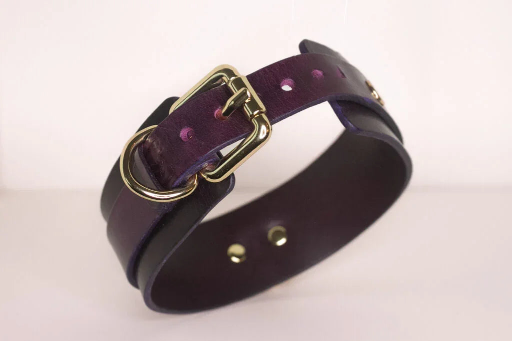 Side view of the 'Milky Way' burgundy BDSM collar, detailing the elegant gold-tone buckle and the multiple size adjustment holes.