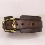 Detailed view of the buckle fastening of the 'Mesa' brown leather BDSM collar, highlighting the precision stitching and gold-tone hardware.