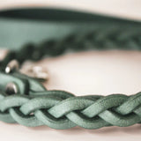 Close-up of the braided Yucca green leather leash's handle, displaying the craftsmanship and silver-tone clasp.