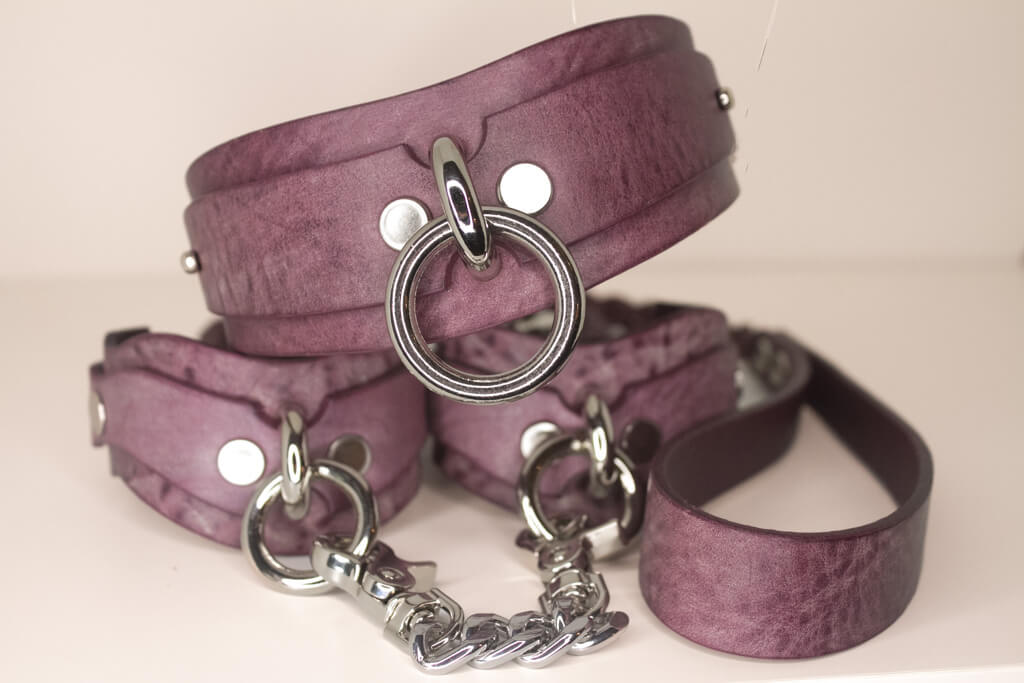 Haze purple leather BDSM collar and leash set with silver-tone O-rings and chain.