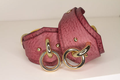 Handcrafted Desert Rose Italian leather cuff with gold-tone buckle and hardware, symbolizing luxury and kink.