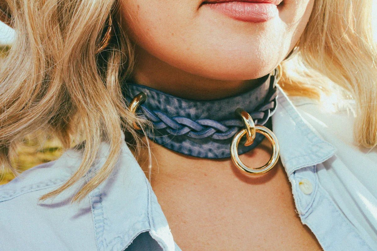 front view woman outside wearing cowboy core blue leather luxury bdsm collar 