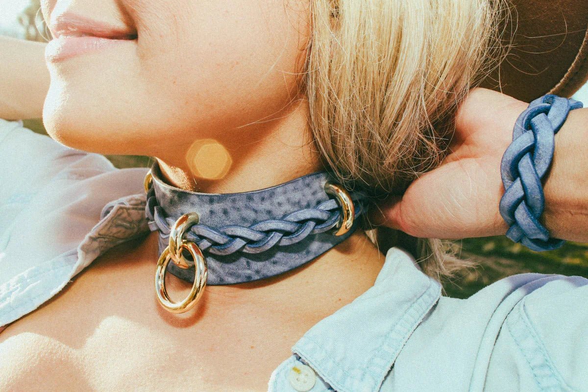 woman at stagecoach wearing blue leather cowboy core festival fashion
