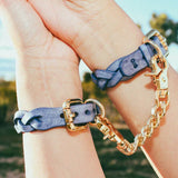woman wearing blue luxury leather bracelets with gold hardware