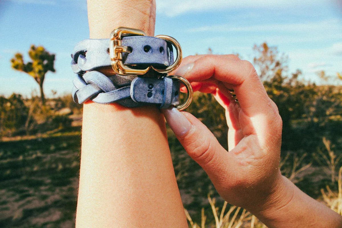 woman attending stagecoach wearing blue leather cowboy core bracelets