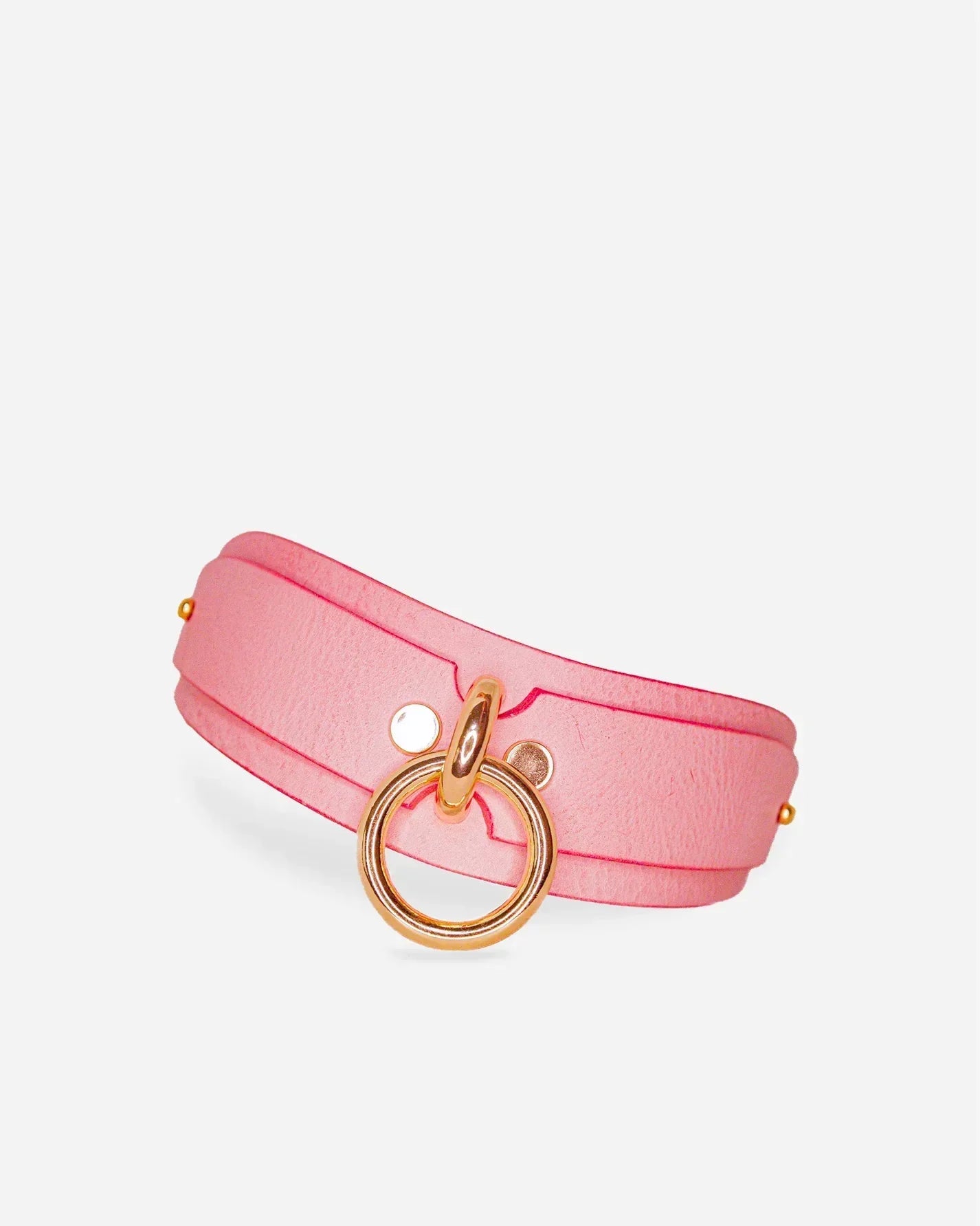 Pink leather day collar with gold ring and rivet details, premium leather cuffs style