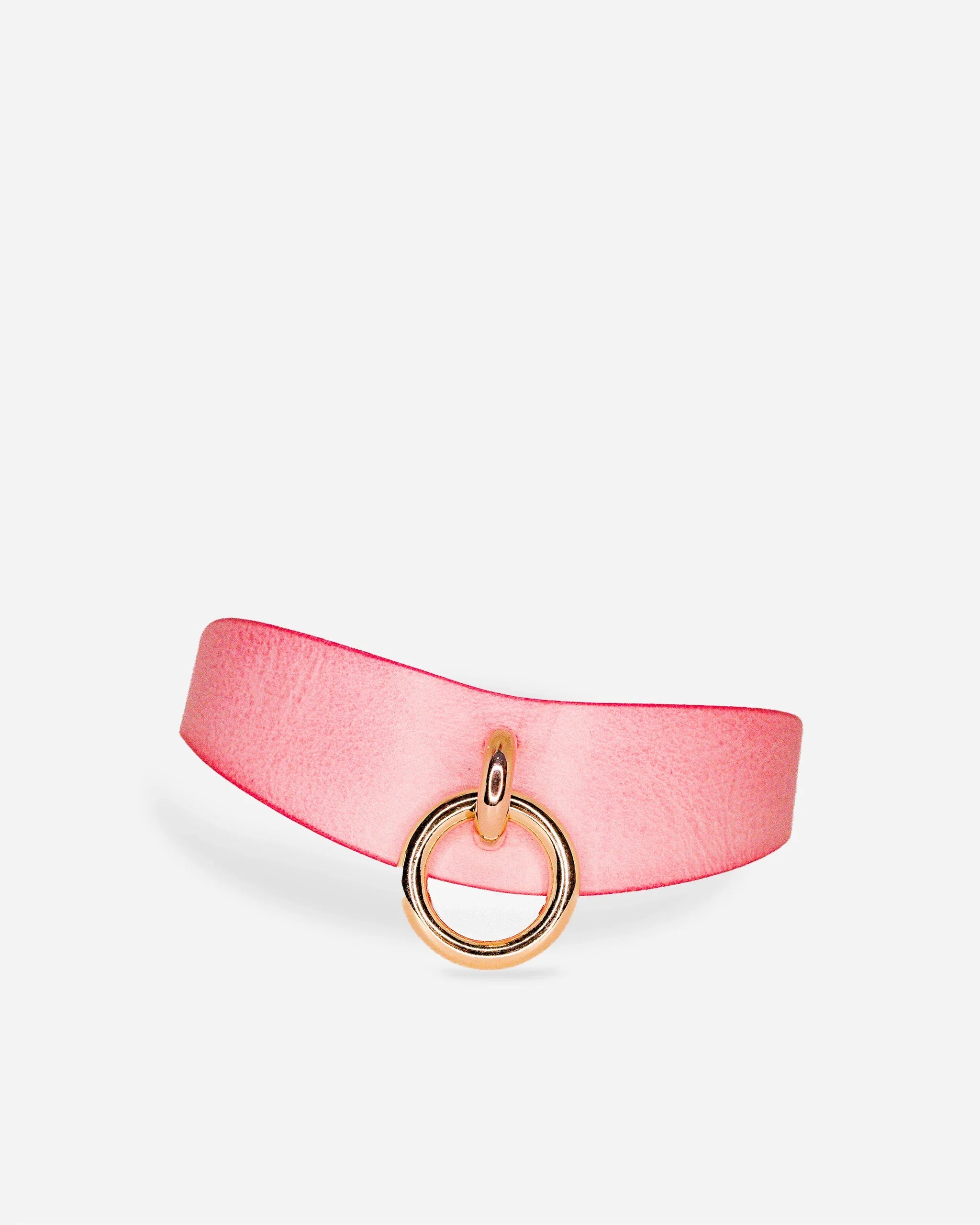 Pink leather day collar with gold ring detail on white background, showcasing custom leather collars