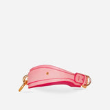 Pink leather wrist cuff with gold hardware, minimalist design, and sturdy buckle closure