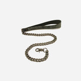 Black leather day collar with silver chain leash and clasp on white background