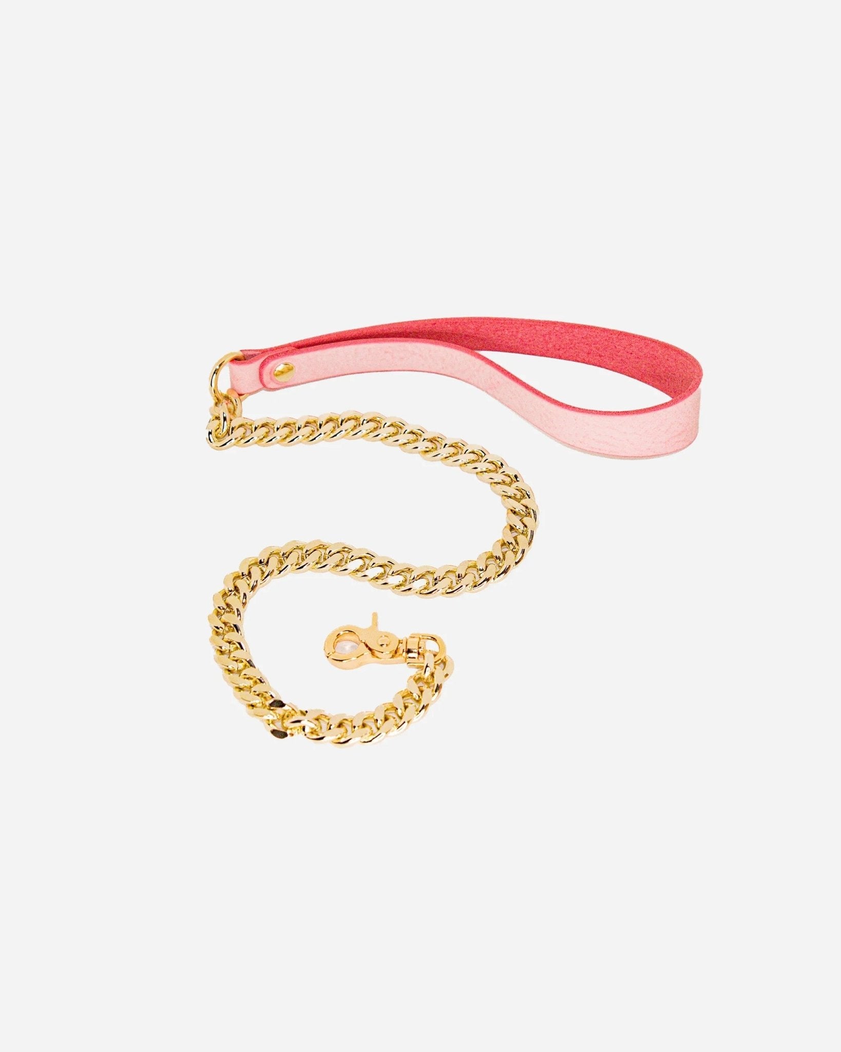 Blush pink leather wrist cuff with gold chain leash and clasp on white background, leather cuffs and collars