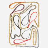 Leather day collar and leather wrist cuffs with gold and silver chain leashes in various colors