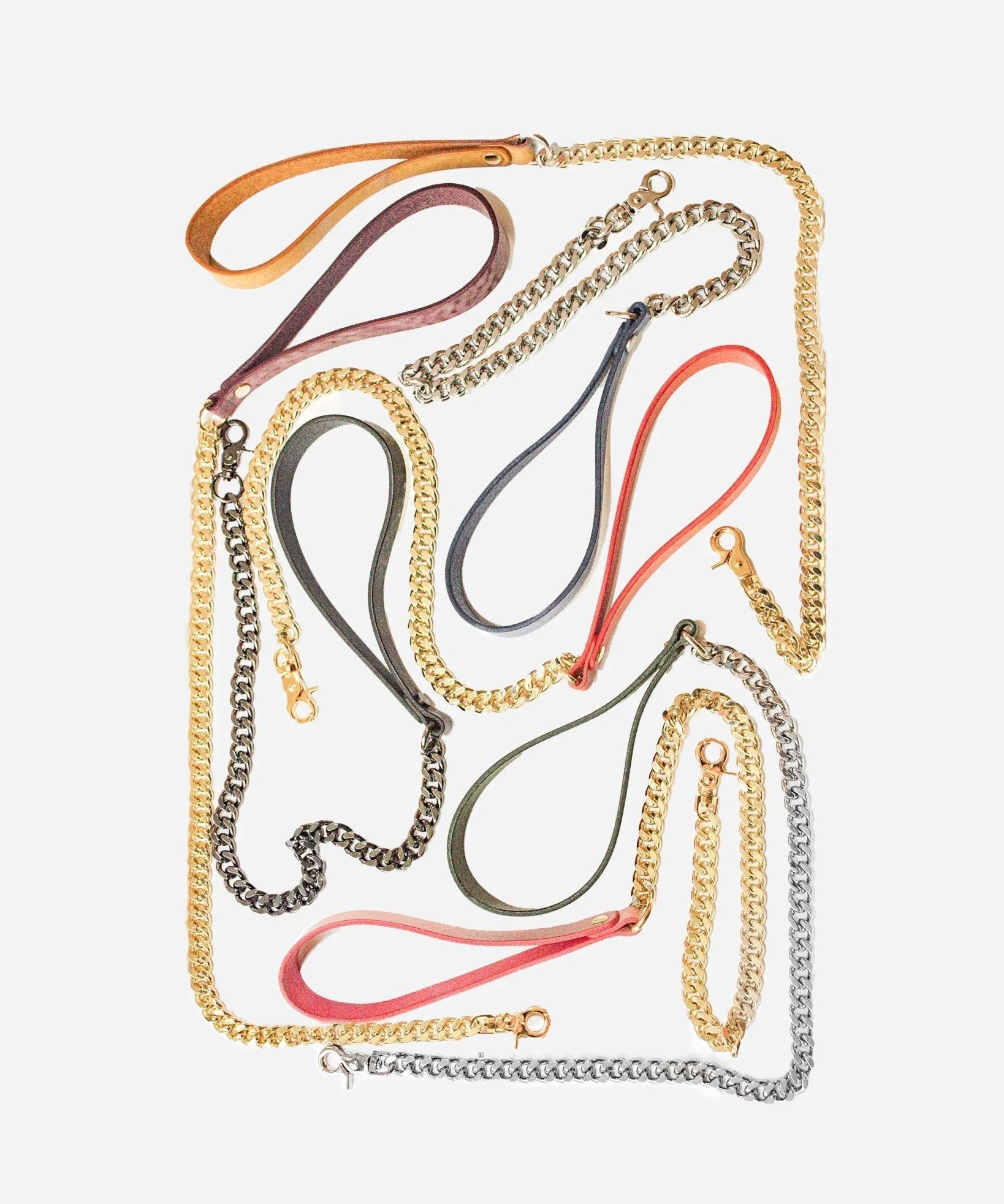 Leather day collar and leather wrist cuffs with gold and silver chain leashes in various colors