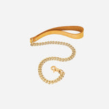 Gold chain leash with tan leather wrist cuff against a white background, highlighting leather wrist cuffs