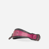 Custom full-grain leather day collar in pink and black with metal buckle and rivet detail