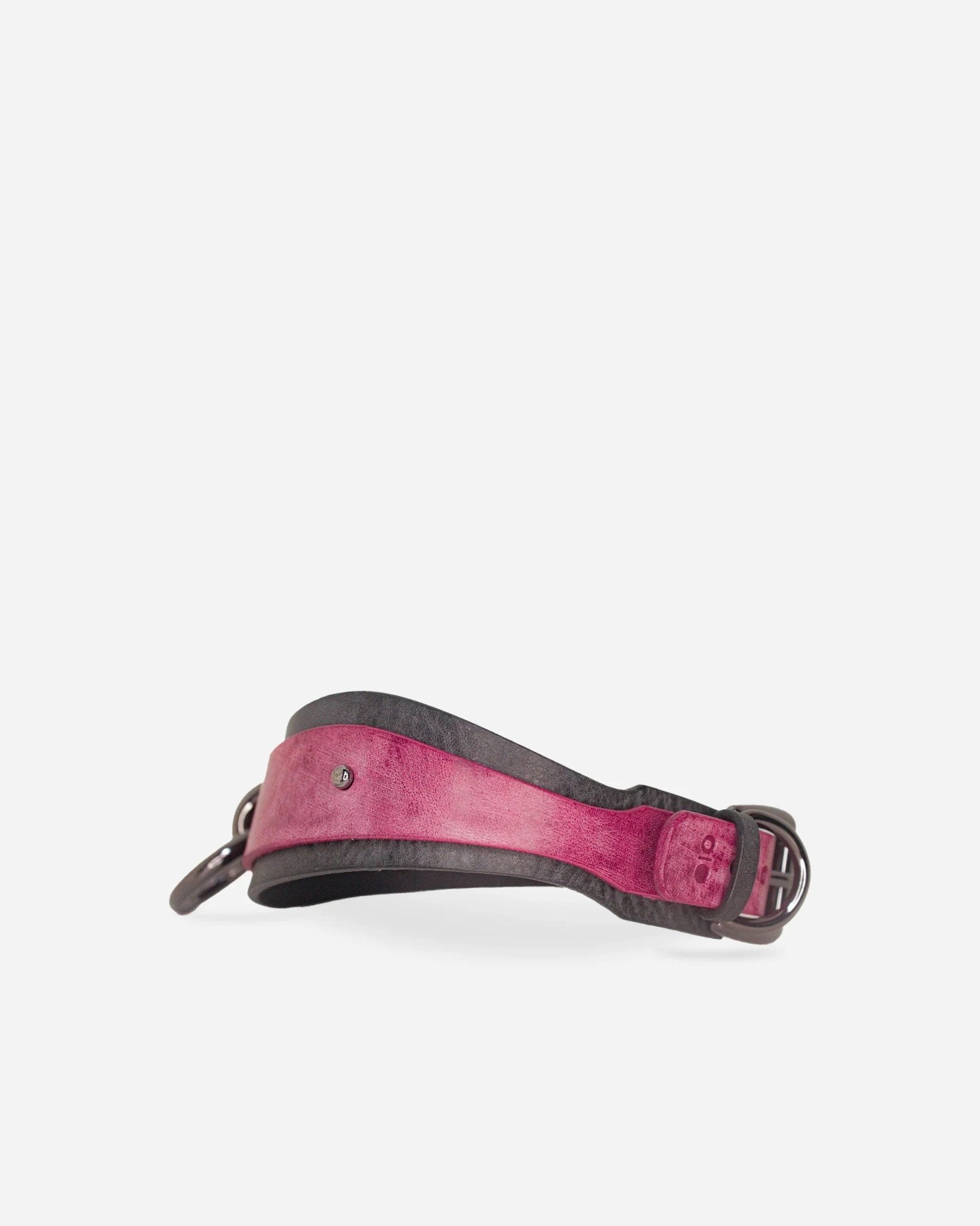 Custom full-grain leather day collar in pink and black with metal buckle and rivet detail