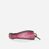 Pink and black leather day collar with metal hardware, showcasing custom leather collar craftsmanship