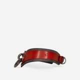 Red and black leather day collar with metal rings, showcasing full-grain leather craftsmanship