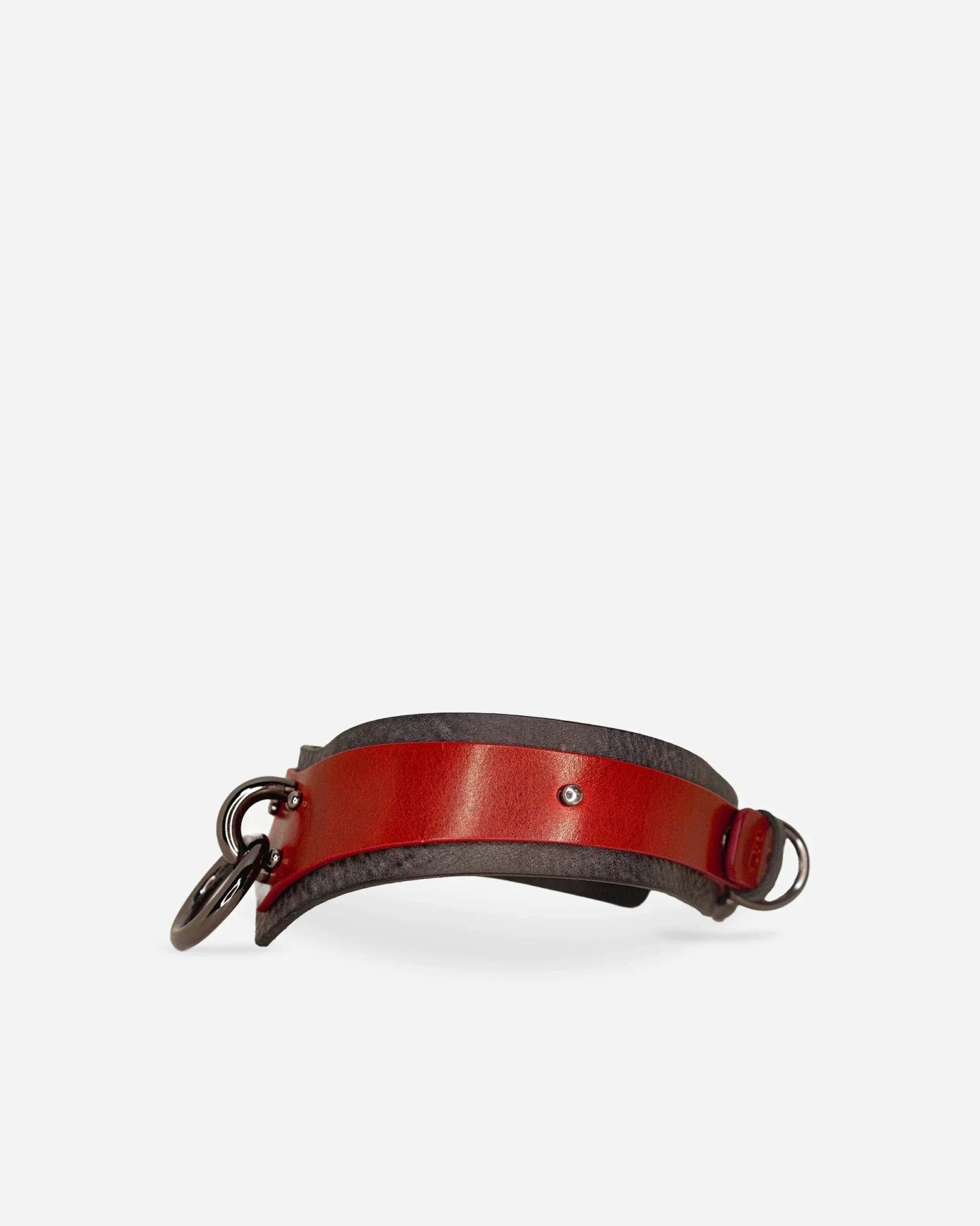 Red and black leather day collar with metal rings, showcasing full-grain leather craftsmanship