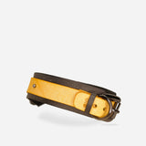 Custom leather day collar in yellow and black with metal buckle and rivet detail