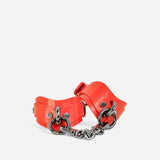 custom red cuffs with black chain connectors