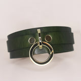Sophisticated 'Moss' green leather BDSM collar with a prominent gold-tone O-ring set against a subtle grey background, emphasizing the collar's rich hue and quality material.