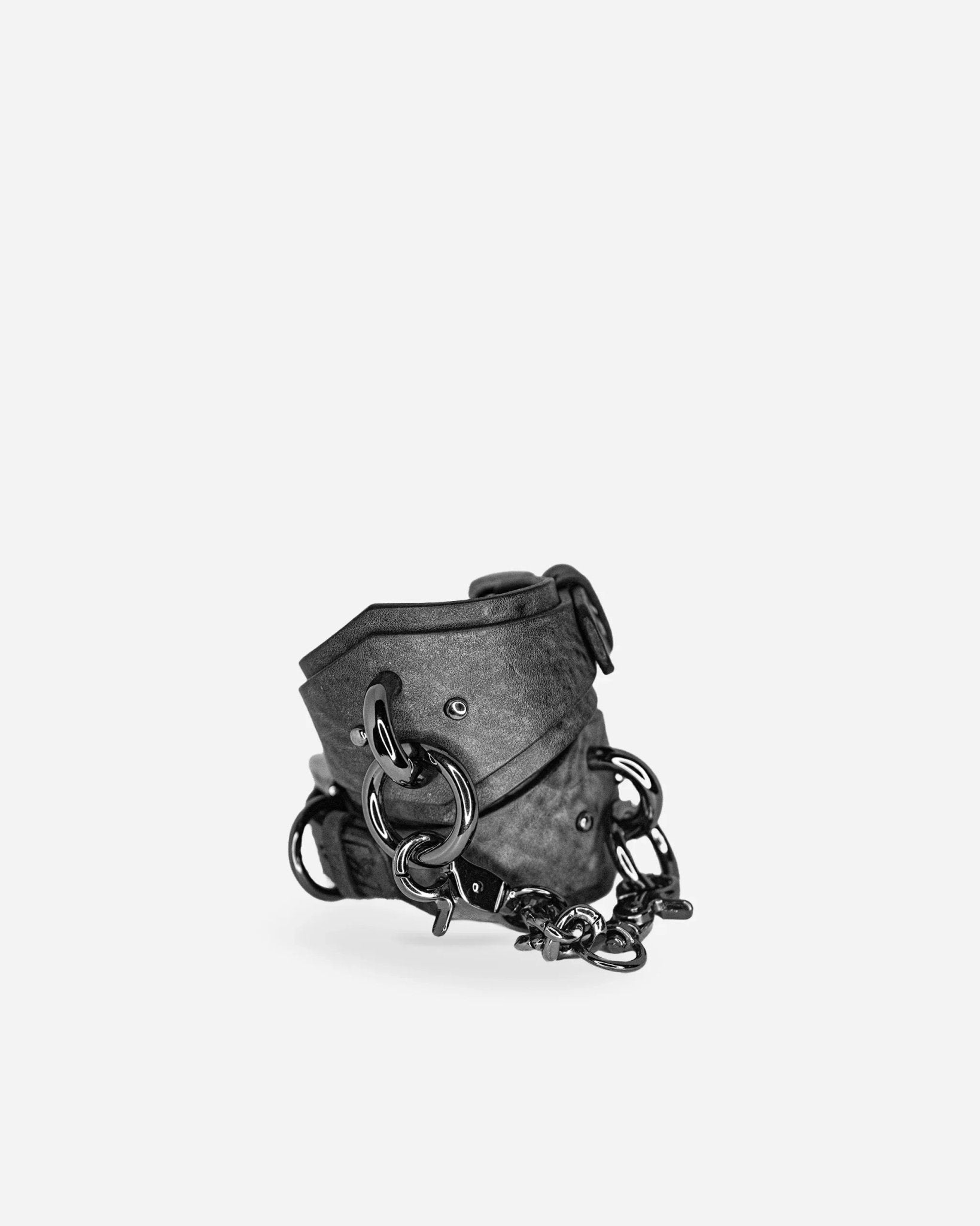 Black leather wrist cuffs with heavy metal rings and chain, custom leather cuffs design