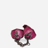 Pair of purple leather wrist cuffs connected by black chain links, featuring metal rings and rivets