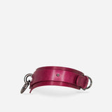 Bordeaux leather day collar with silver metal rings and buckle on white background
