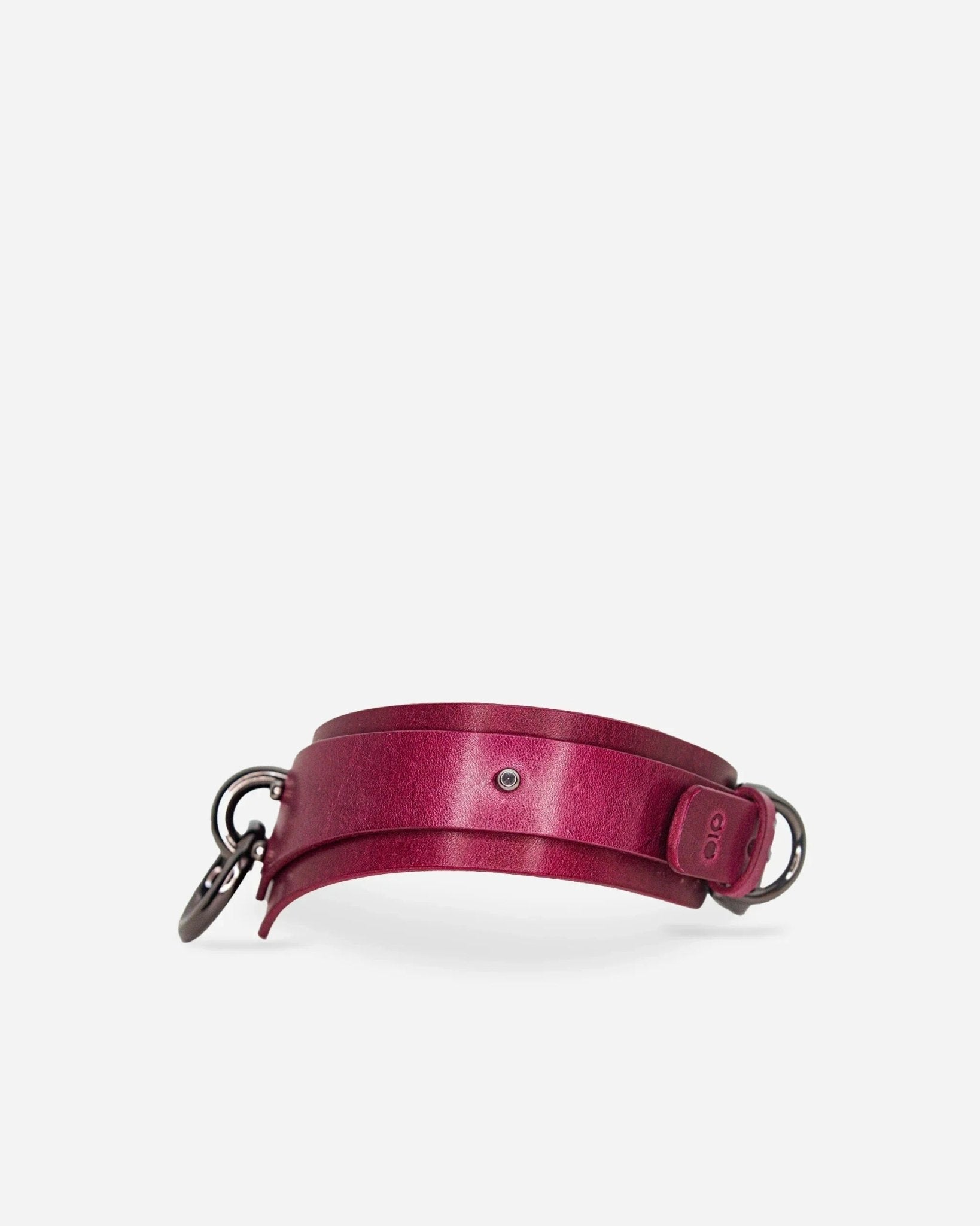 Bordeaux leather day collar with silver metal rings and buckle on white background