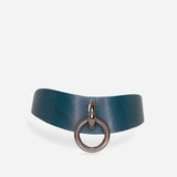 Teal leather day collar with a central metal ring, minimalist design on white background