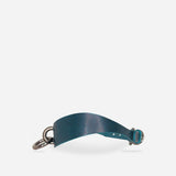 Blue leather day collar with metal rings and buckle on white background, featuring finely crafted leather collars