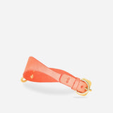Orange leather day collar with gold buckle and loop on white background, leather wrist cuffs style