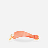 Custom orange leather day collar with gold hardware, a leather wrist cuffs accessory