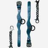 Blue Italian leather wrist cuffs with metal rings and chain connectors on white background