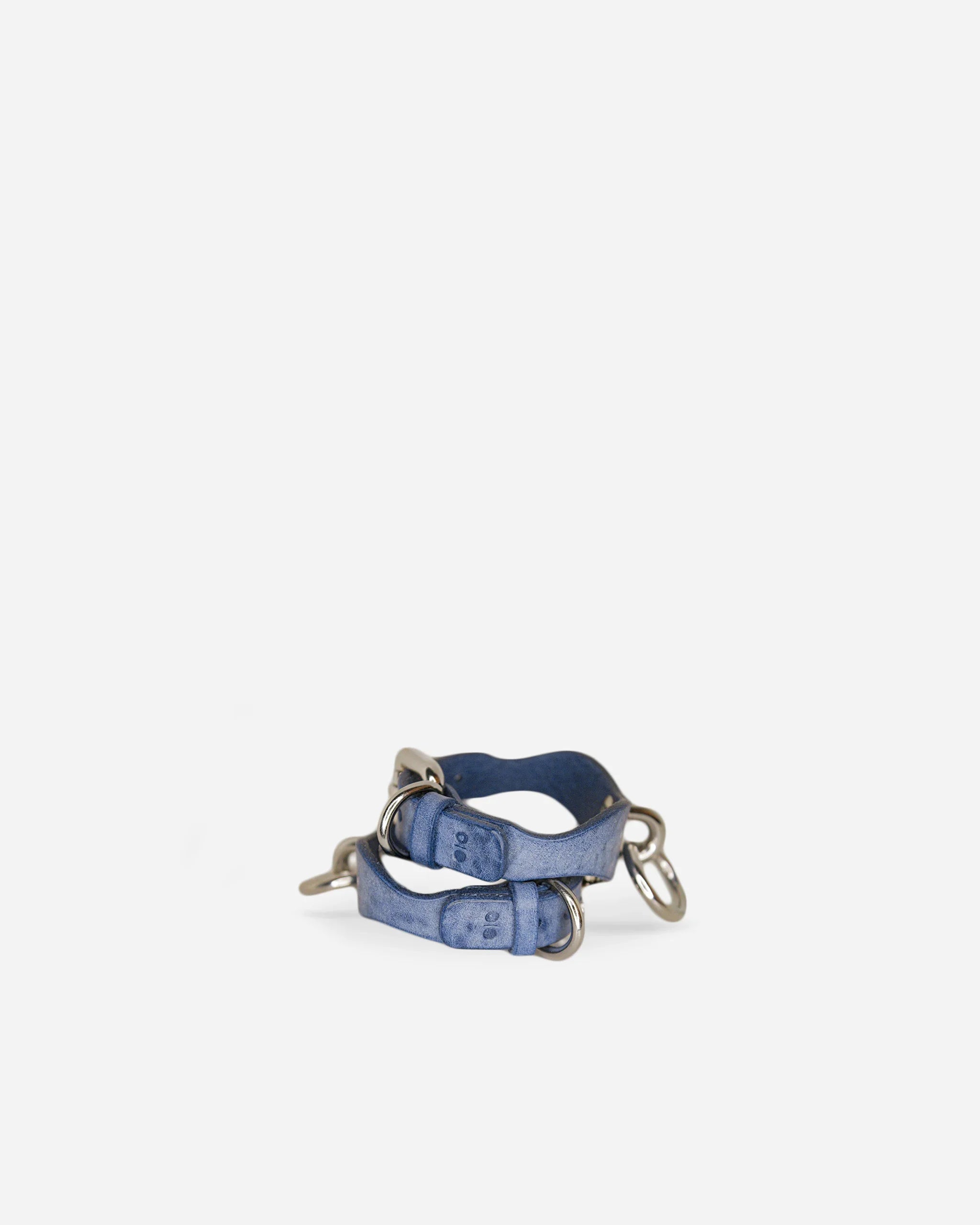Blue leather wrist cuffs with silver hardware, handcrafted full-grain Italian leather