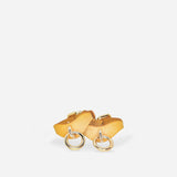 Golden hour leather wrist cuffs with silver rings on white background, custom leather cuffs