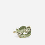 Orbit Pistachia green full-grain leather wrist cuffs with silver buckles on white background