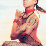 woman wearing red bdsm collar and cuffs